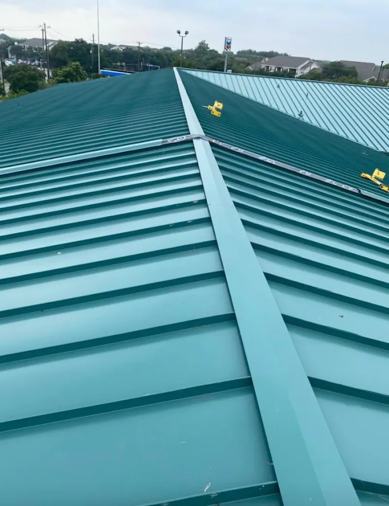 Green commercial metal roof ridge and valley for Metal Roof Repair in Broomfield